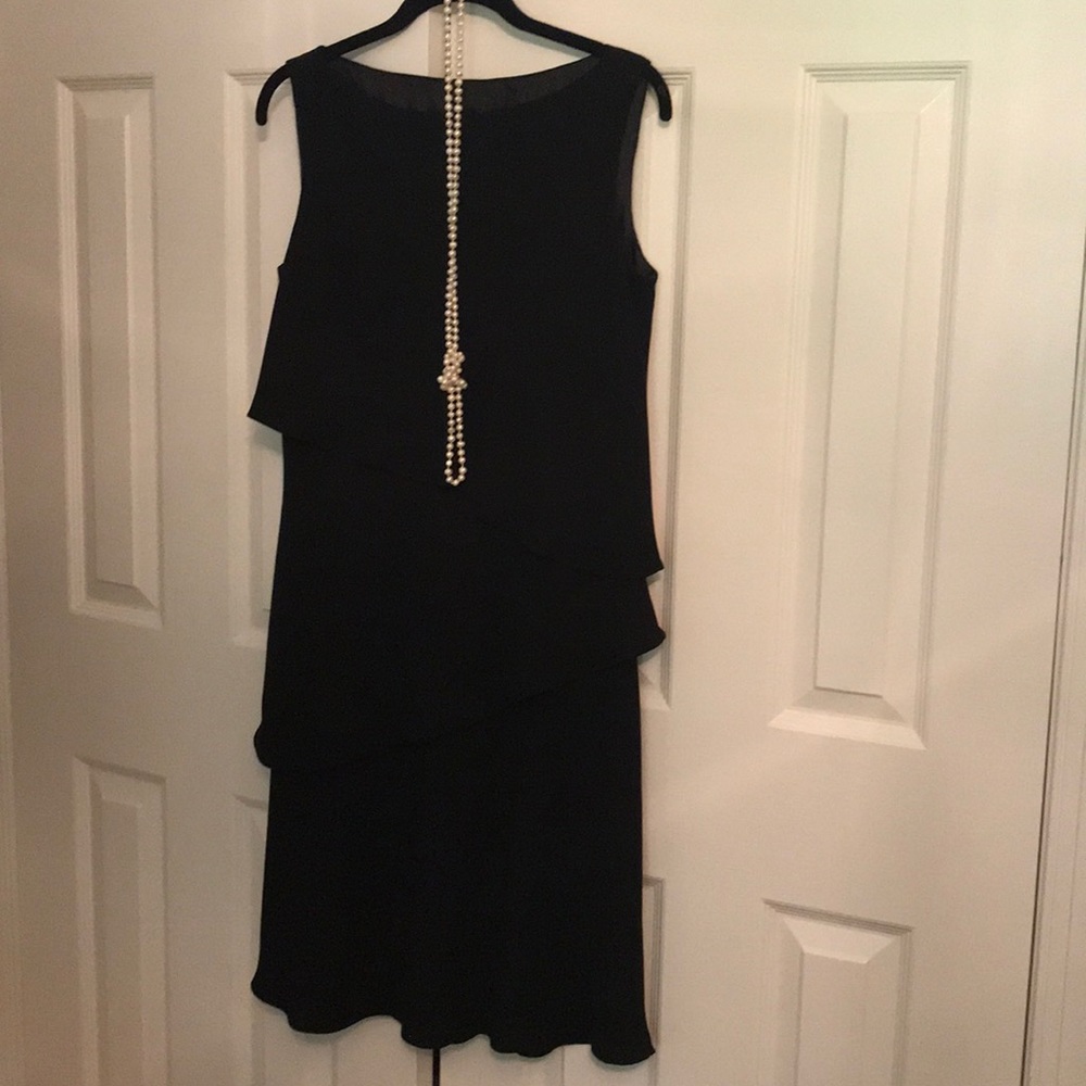 Black sleeveless dress with flouncy layers